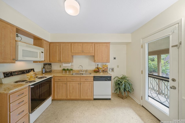 kitchen with sink, light brown cabinets, and white appliances