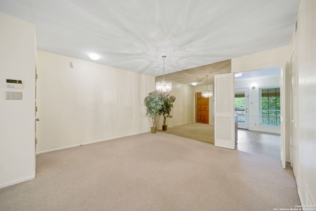 2300 Nacogdoches Rd Unit 232-I, San Antonio, TX 78209 - empty room with carpet floors, a notable chandelier, and baseboards