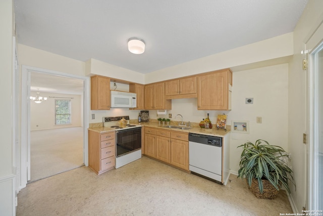 kitchen featuring light brown cabinetry, sink, an inviting chandelier, and white appliances