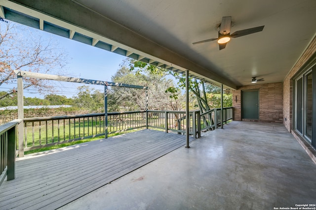 exterior space featuring ceiling fan