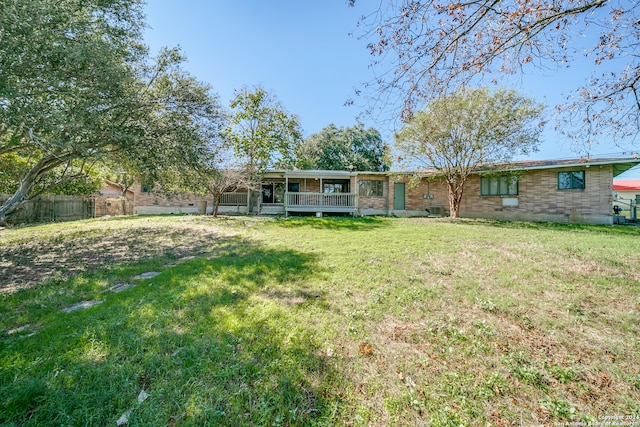 back of house featuring a yard