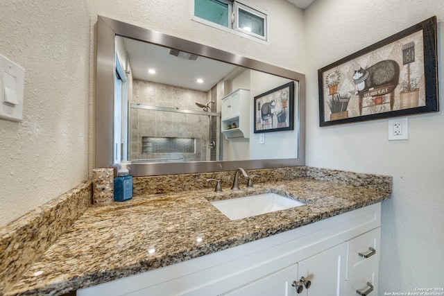 bathroom featuring vanity and walk in shower