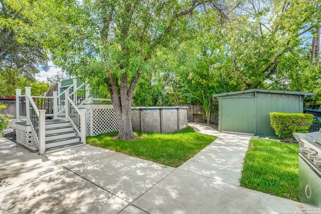 view of yard with a storage unit