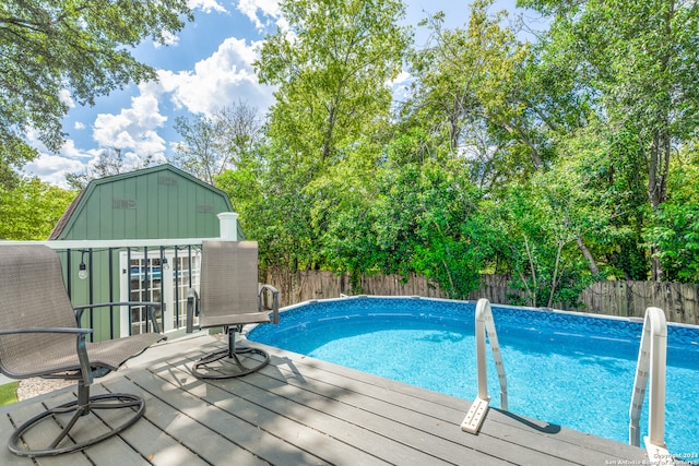 view of pool with a wooden deck