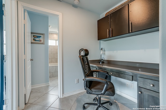 tiled office space featuring built in desk