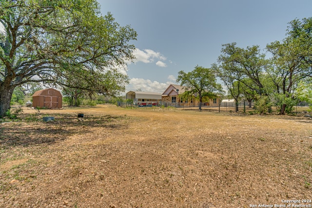 view of yard with a storage shed