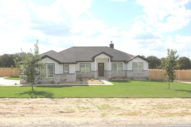 craftsman house featuring a front lawn