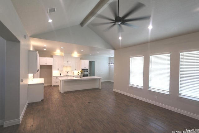 unfurnished living room featuring dark wood-type flooring, high vaulted ceiling, beamed ceiling, ceiling fan, and sink