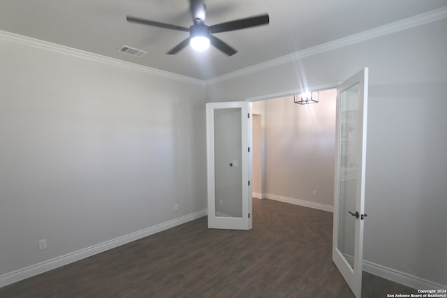 unfurnished room featuring ceiling fan, crown molding, and dark hardwood / wood-style flooring