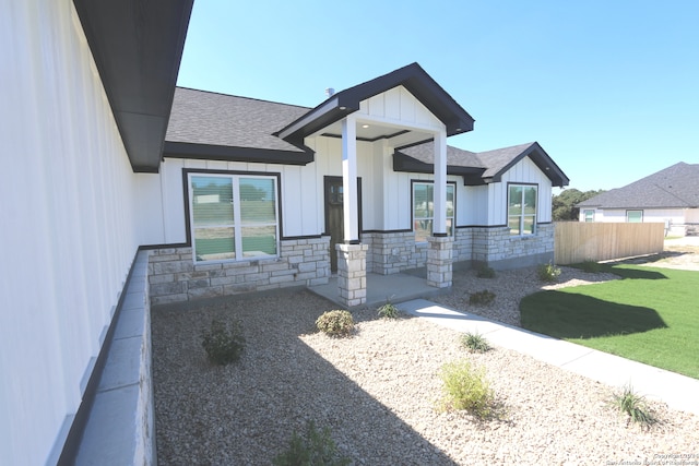 modern inspired farmhouse featuring a patio and a front lawn