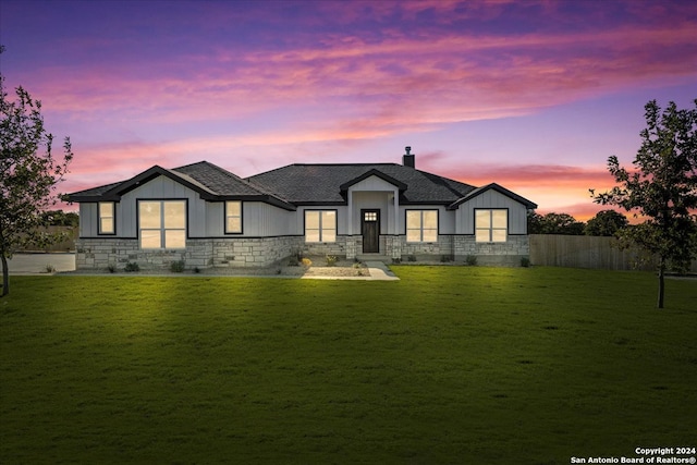 view of front of home with a lawn