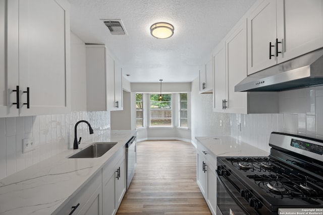 kitchen featuring dishwasher, white cabinetry, sink, and black range with gas stovetop