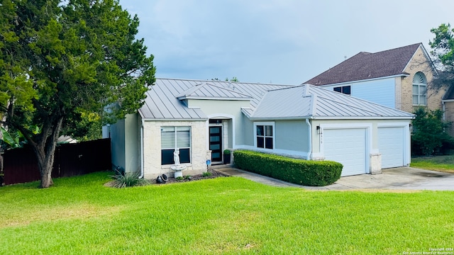 view of front facade with a garage and a front lawn