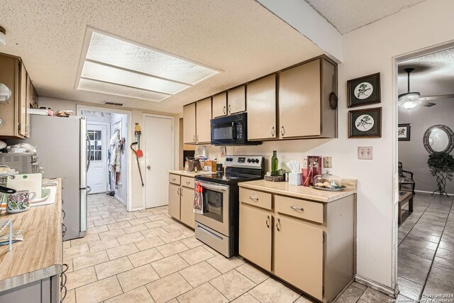 kitchen with stainless steel range with electric cooktop, a textured ceiling, and ceiling fan