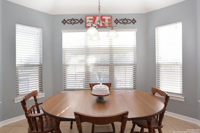 tiled dining area with a healthy amount of sunlight