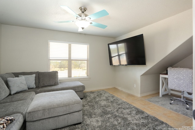 tiled living room featuring a textured ceiling and ceiling fan