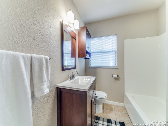 bathroom with tile patterned flooring, vanity, and toilet