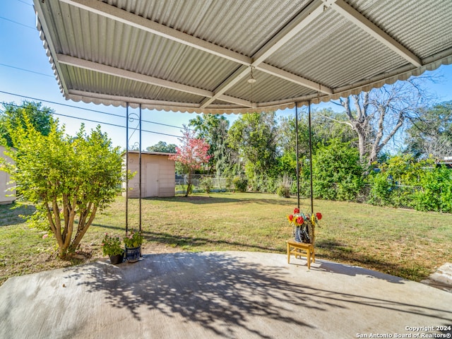 view of patio with a shed