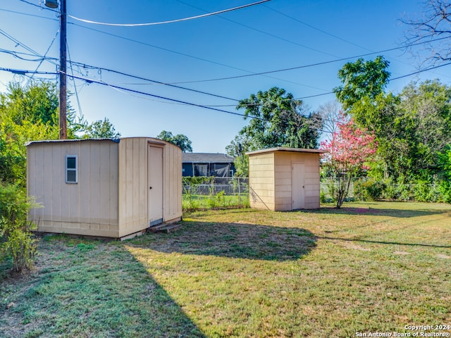 view of yard with a storage unit