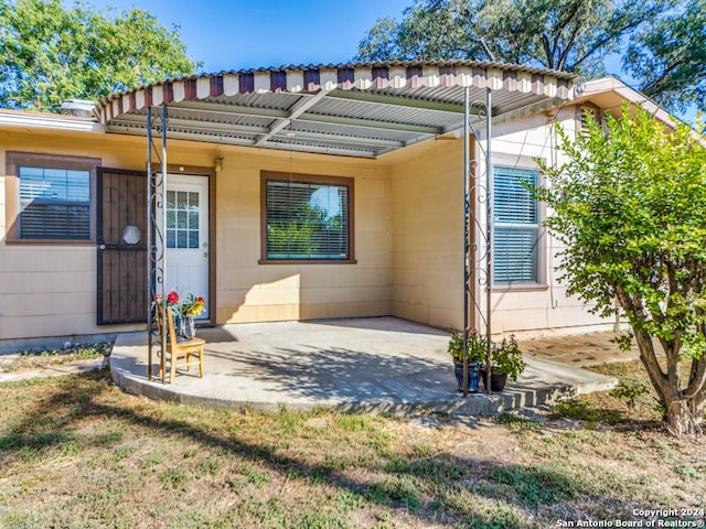 back of property featuring a patio area