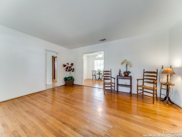 sitting room with light hardwood / wood-style flooring