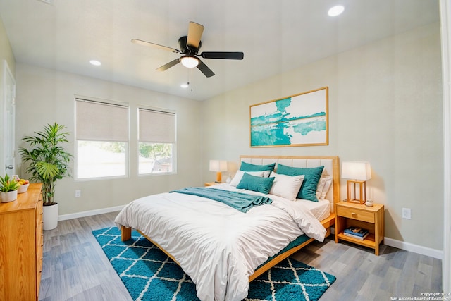 bedroom featuring ceiling fan and hardwood / wood-style flooring