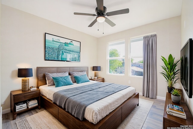 bedroom featuring ceiling fan and light wood-type flooring