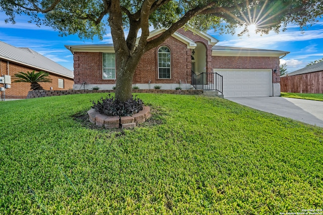 single story home with a front lawn and a garage