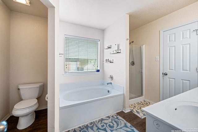 full bathroom with vanity, separate shower and tub, toilet, and hardwood / wood-style flooring