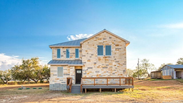 view of front of property featuring a wooden deck