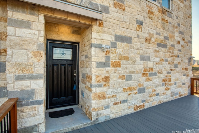 entrance to property featuring a deck