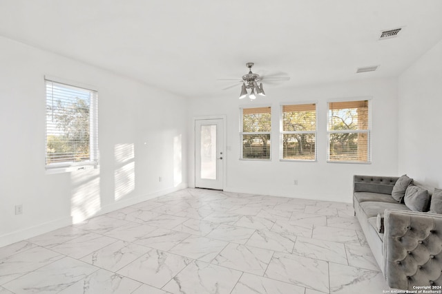 living area featuring ceiling fan