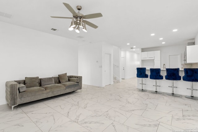 living room featuring ceiling fan