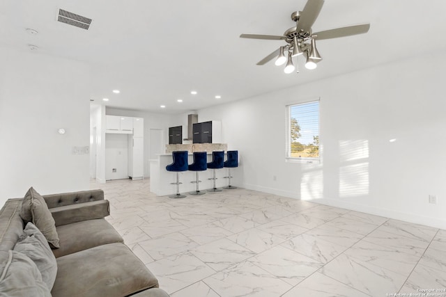 living room featuring ceiling fan