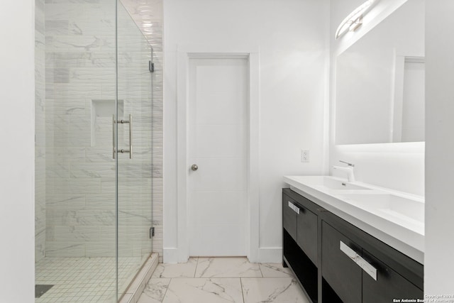 bathroom with vanity and an enclosed shower