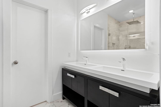 bathroom with vanity and tiled shower