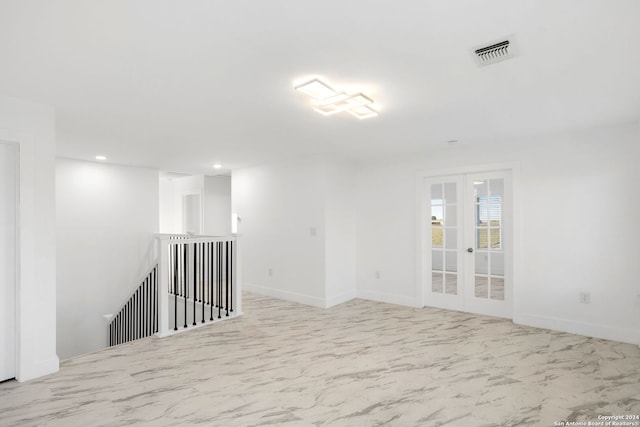 empty room featuring french doors