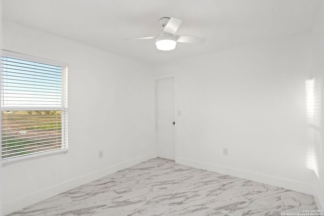 spare room with ceiling fan