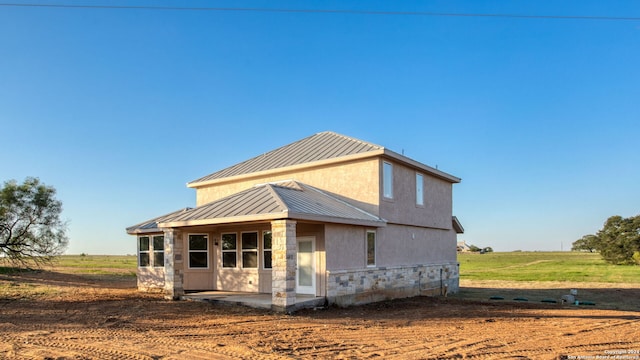 rear view of property featuring a rural view