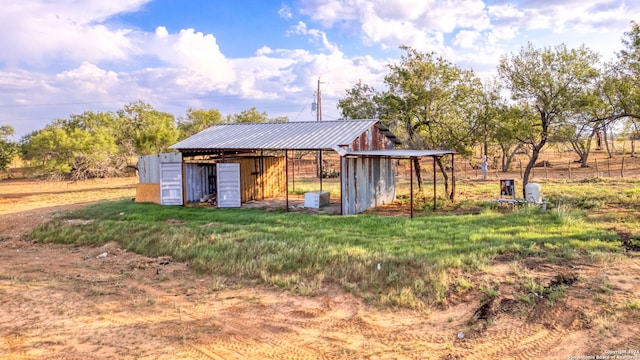 view of outbuilding featuring a rural view