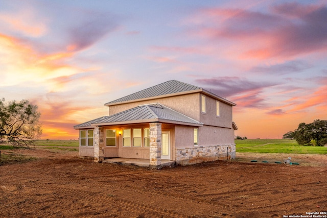 view of property exterior at dusk