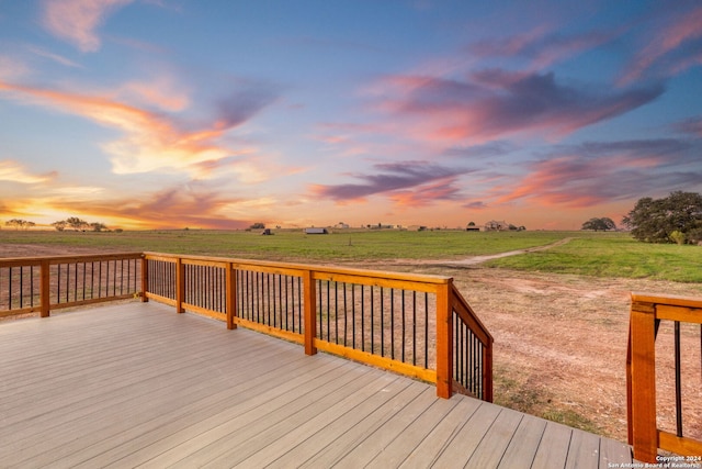 deck at dusk with a rural view