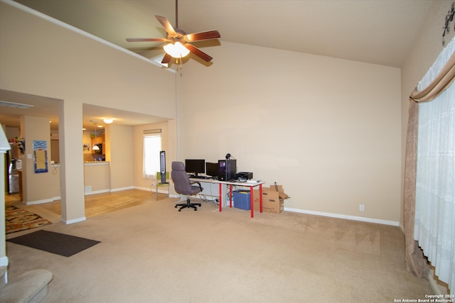 office with ceiling fan, light colored carpet, and high vaulted ceiling