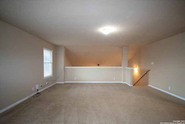 9171 Everton, San Antonio, TX 78245 - additional living space with baseboards, carpet flooring, and lofted ceiling