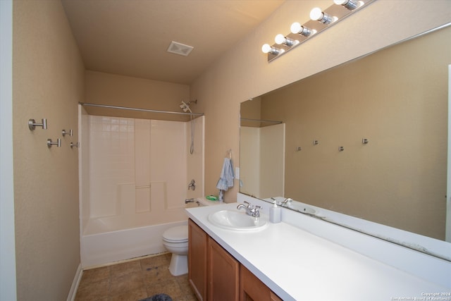 full bathroom featuring bathing tub / shower combination, vanity, and toilet