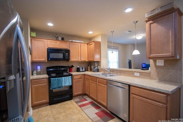9171 Everton, San Antonio, TX 78245 - kitchen featuring a sink, light countertops, backsplash, and black appliances