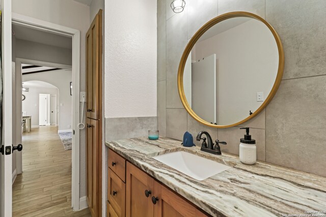 bathroom featuring vanity and hardwood / wood-style flooring