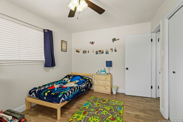 bedroom featuring ceiling fan and hardwood / wood-style floors