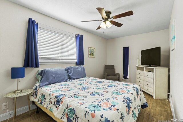 bedroom featuring ceiling fan and wood-type flooring