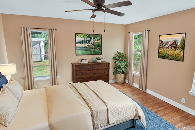 bedroom featuring ceiling fan and hardwood / wood-style flooring